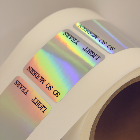 Close up shot of custom printed minimalistic holographic stickers.