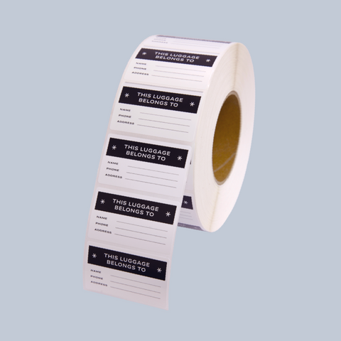 Roll of custom printed rectangle stickers for luggage name tagging.
